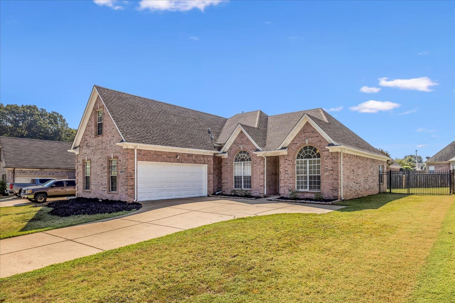 8453 Thor Road Memphis, TN 38018 - Photo 3 of 29 a view of a house with a big yard and large trees