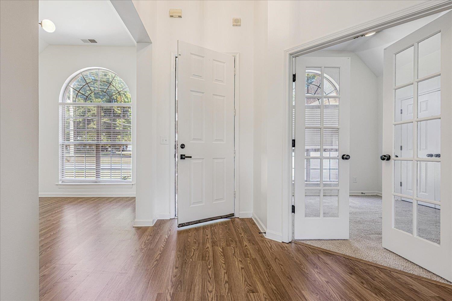 8453 Thor Road Memphis, TN 38018 - Photo 6 of 29 wooden floor in an empty room with a window