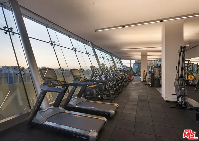 a kitchen with a dining table chairs and white cabinets