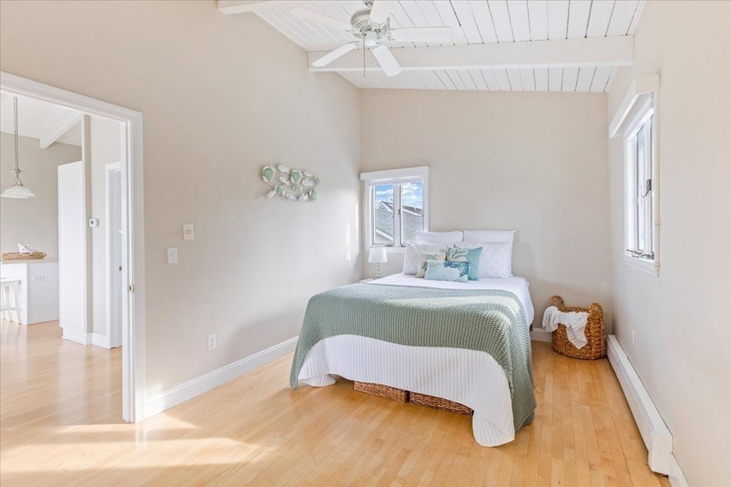 8 Feake Avenue Sandwich, MA 02563 - Photo 17 of 34 a bedroom with a bed and wooden floor