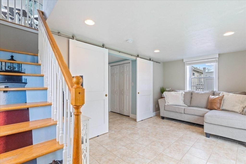 8 Feake Avenue Sandwich, MA 02563 - Photo 18 of 34 a living room with furniture and a large window