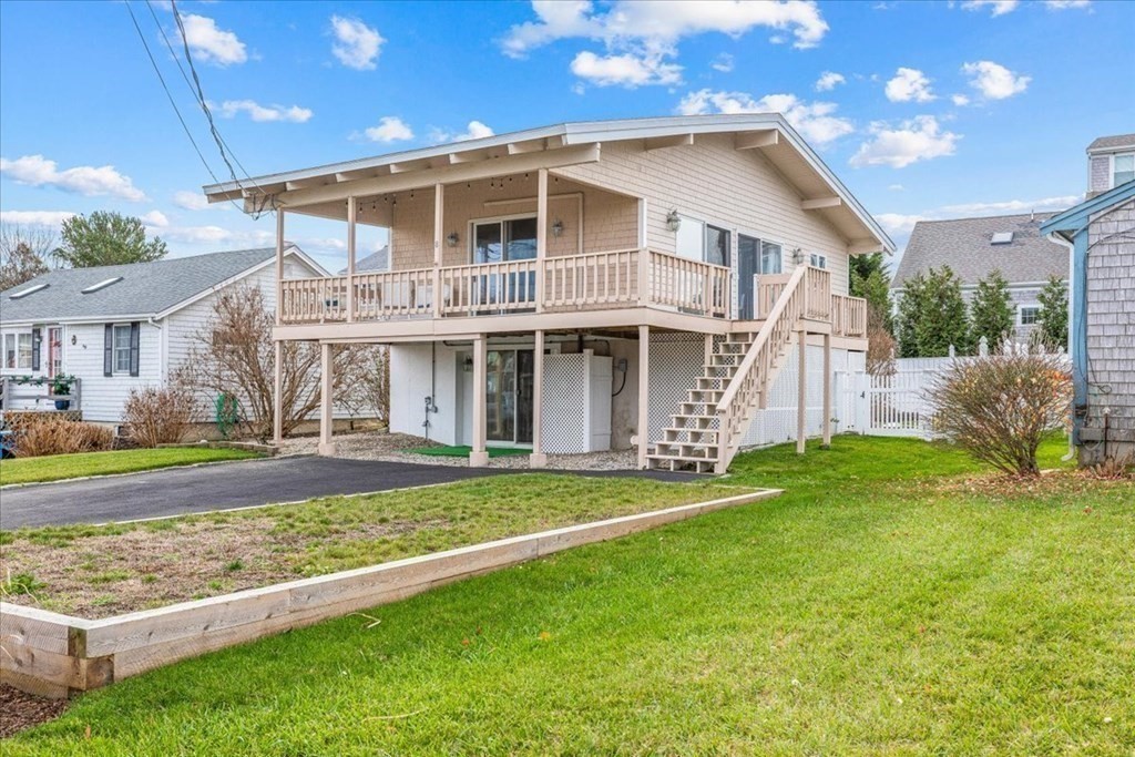 8 Feake Avenue Sandwich, MA 02563 - Photo 32 of 34 a front view of a house with a yard