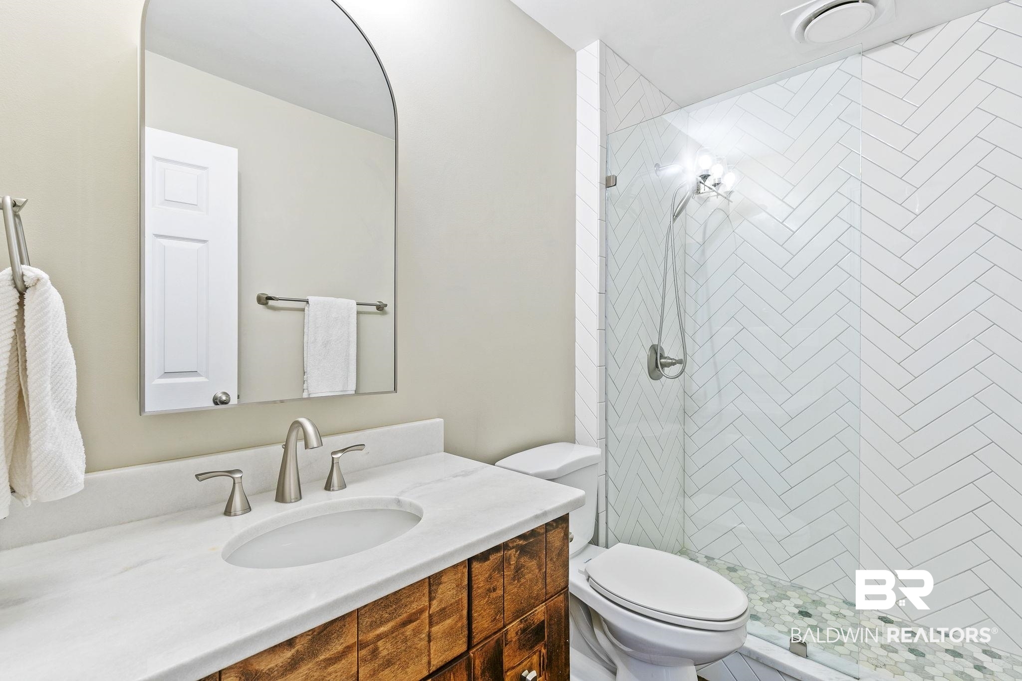 32072 Buzbee Road Daphne, AL 36527 - Photo 17 of 41 Bathroom with a tile shower, vanity, and toilet
