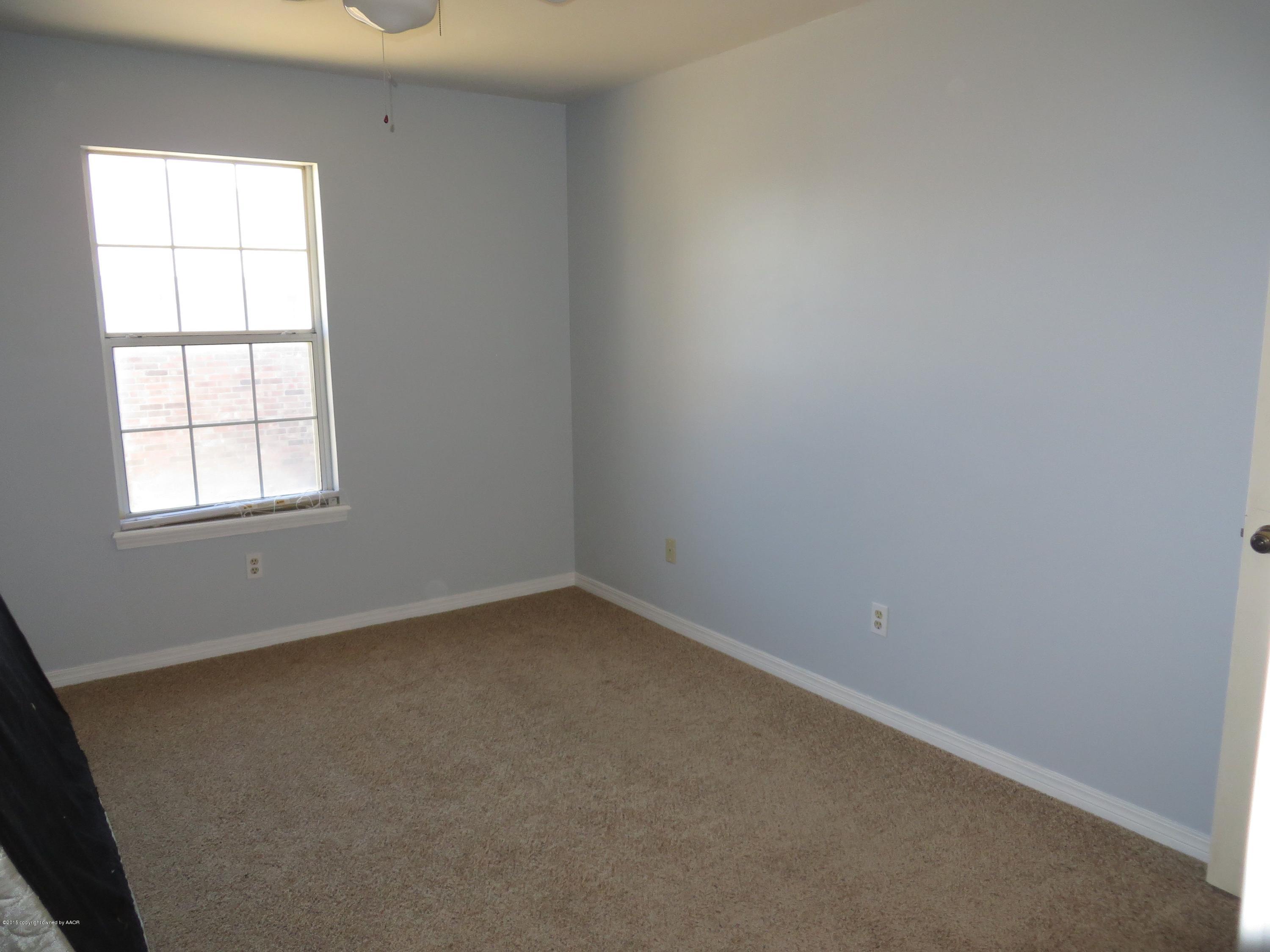 4213 Rincon Avenue Amarillo, TX 79110 - Photo 7 of 9 an empty room with a window