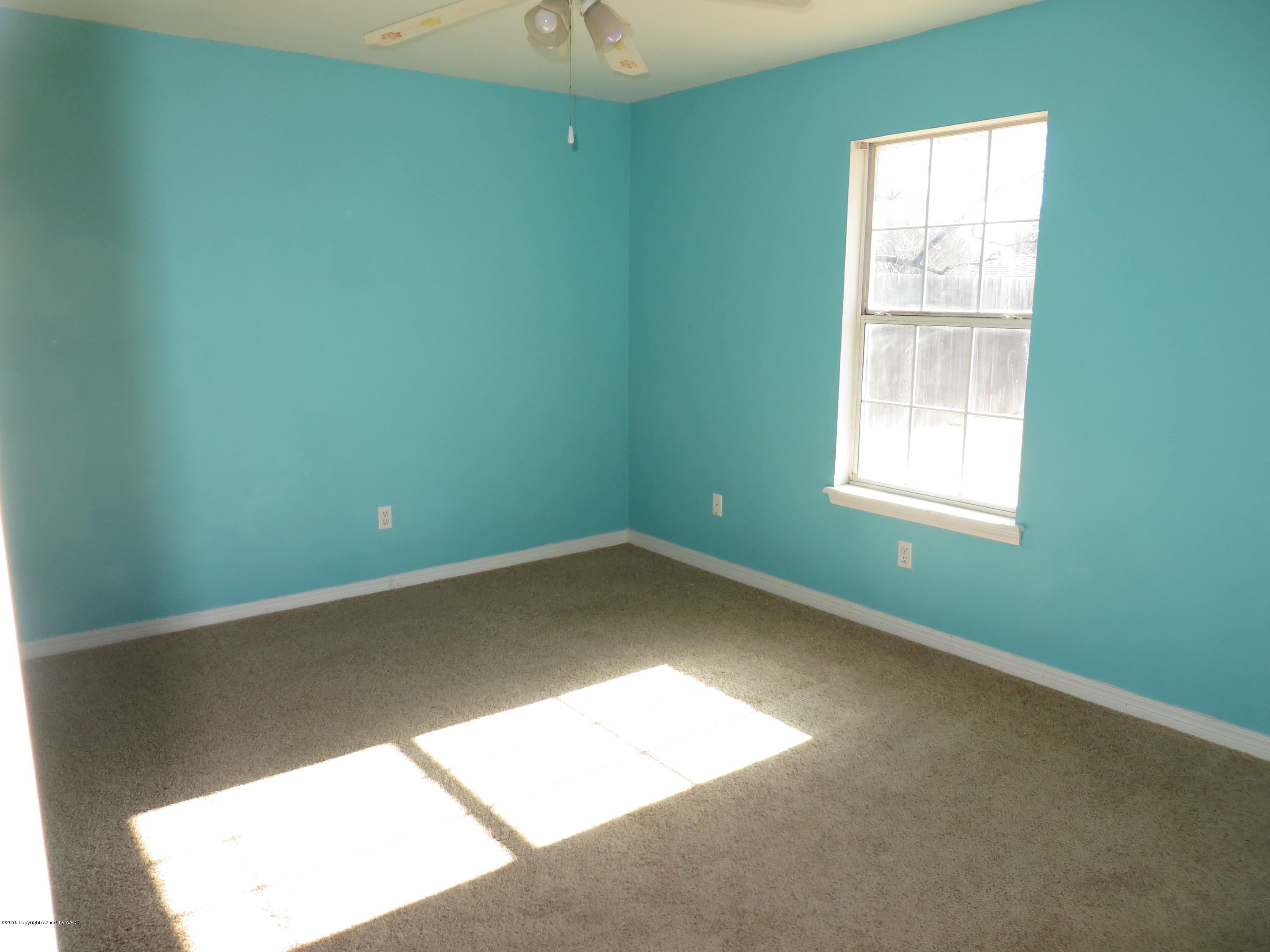 4213 Rincon Avenue Amarillo, TX 79110 - Photo 8 of 9 a view of a room that has a window in it