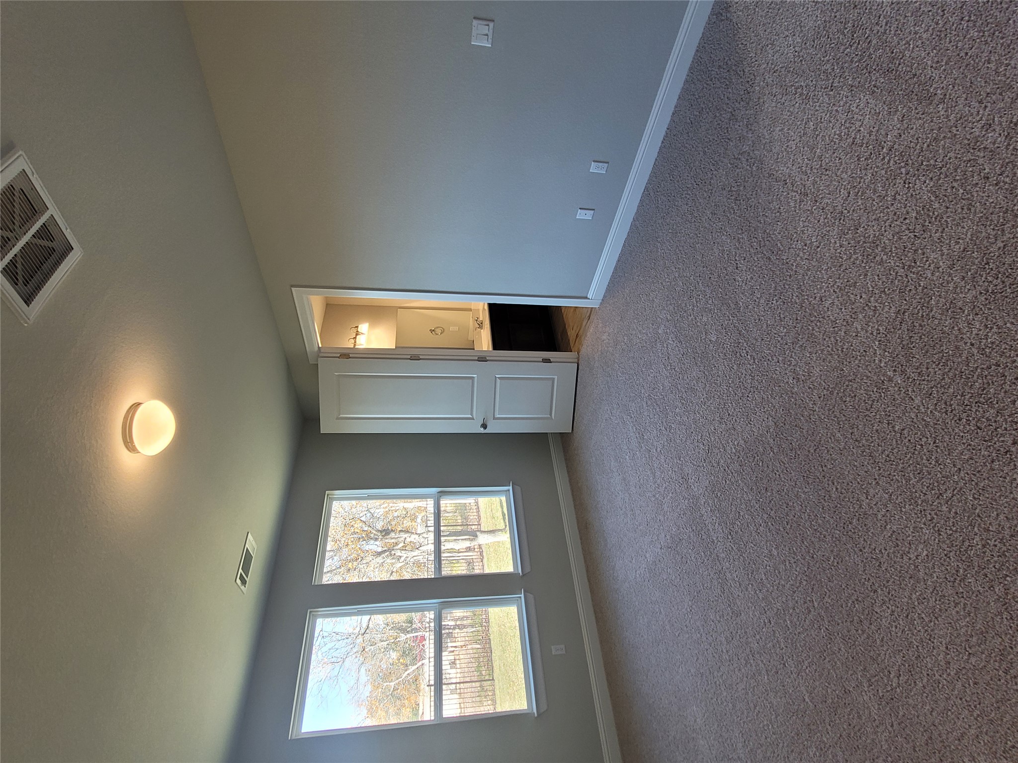 120 Free Stone Drive Georgetown, TX 78628 - Photo 12 of 40 A spacious, naturally illuminated room boasts soft carpeting and a clear view to the backyard.