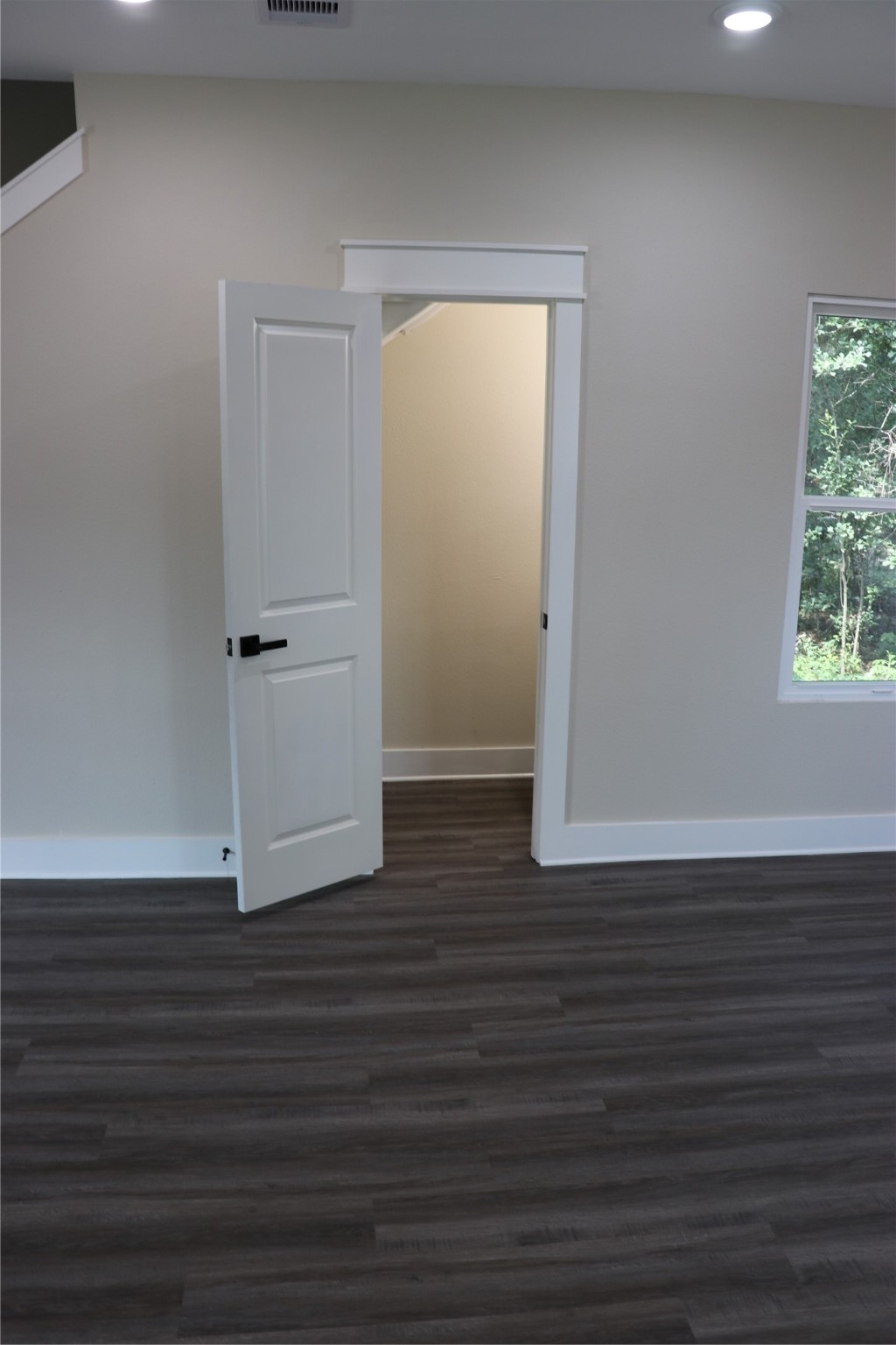 9441 Radio Road, Unit B Houston, TX 77075 - Photo 23 of 24 an empty room with wooden floor and windows