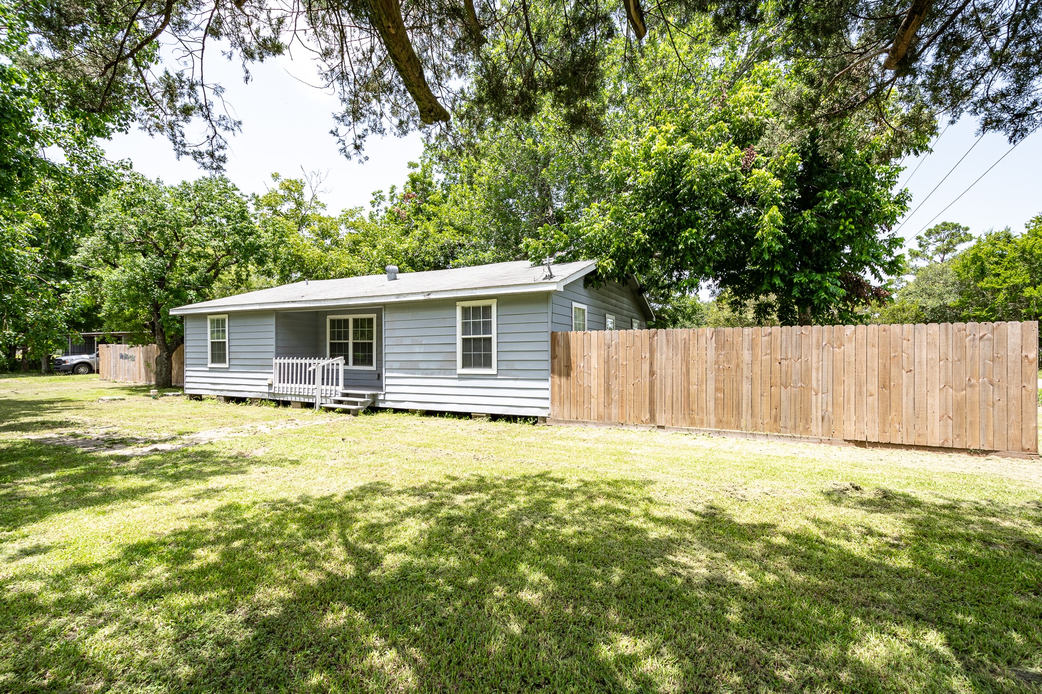 248 Fm-770 Liberty, TX 77575 - Photo 1 of 30 a bathroom with a tub and trees in the background