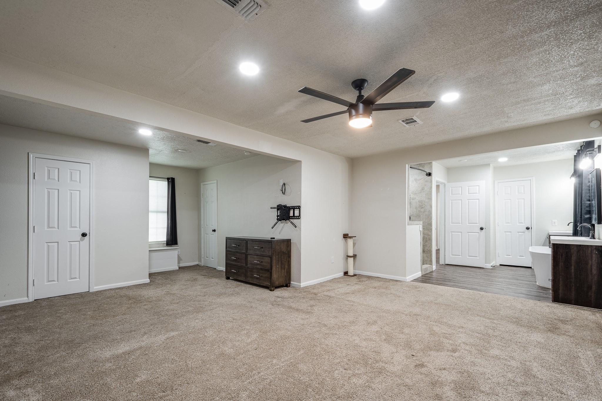 248 Fm-770 Liberty, TX 77575 - Photo 12 of 30 a view of a livingroom with a chandelier fan and windows