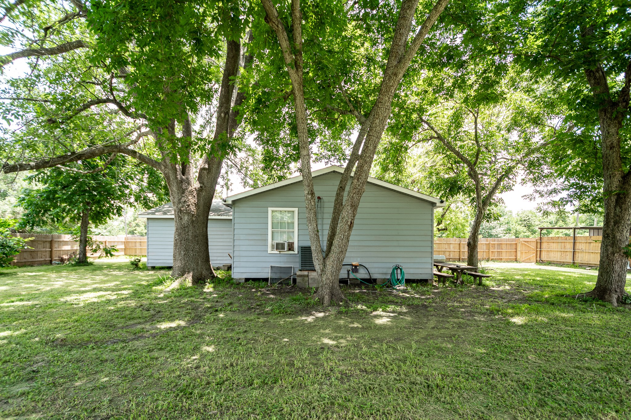 248 Fm-770 Liberty, TX 77575 - Photo 27 of 30 a backyard of a house with plants and large tree
