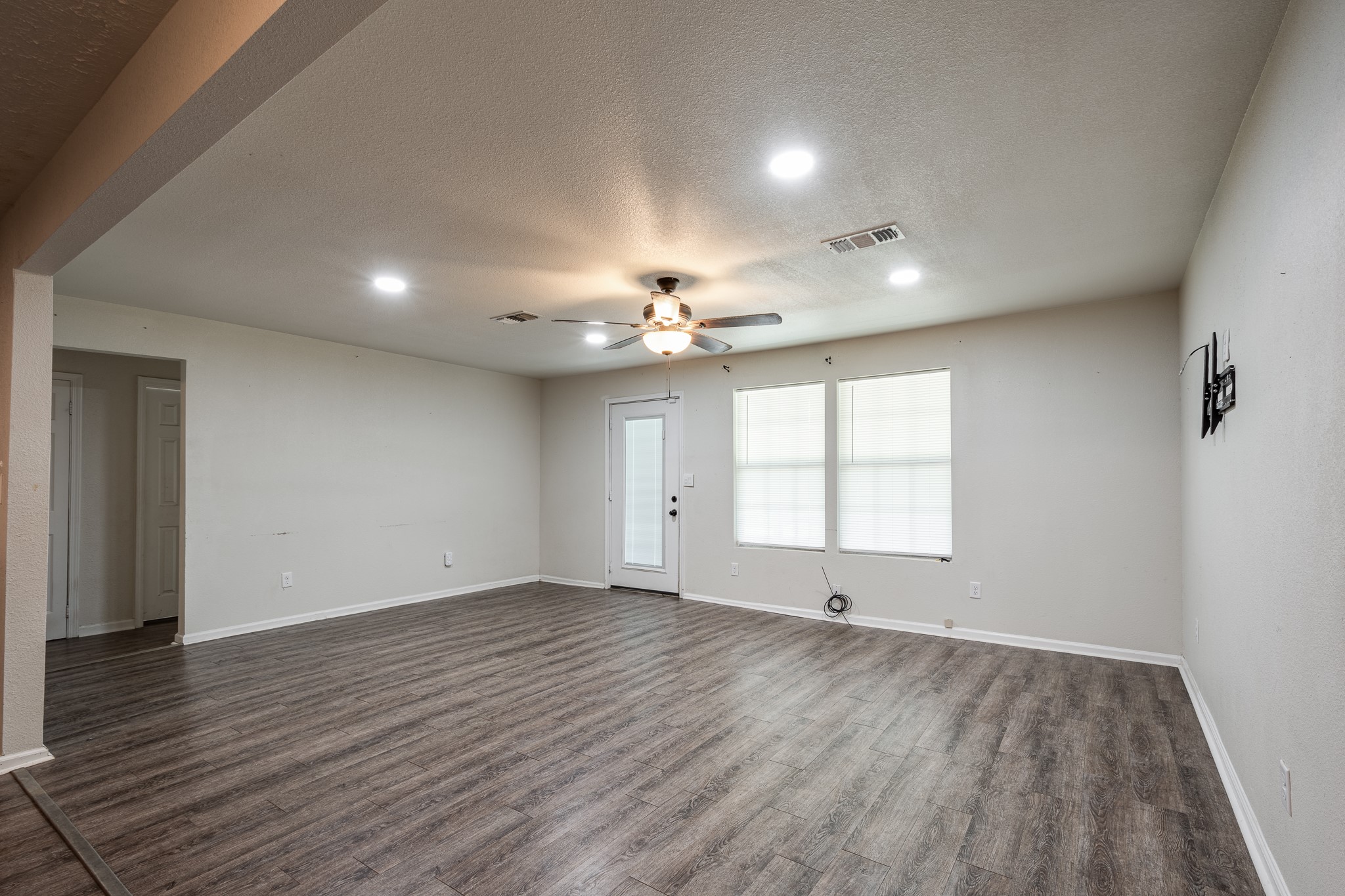 248 Fm-770 Liberty, TX 77575 - Photo 5 of 30 a view of empty room with wooden floor and fan