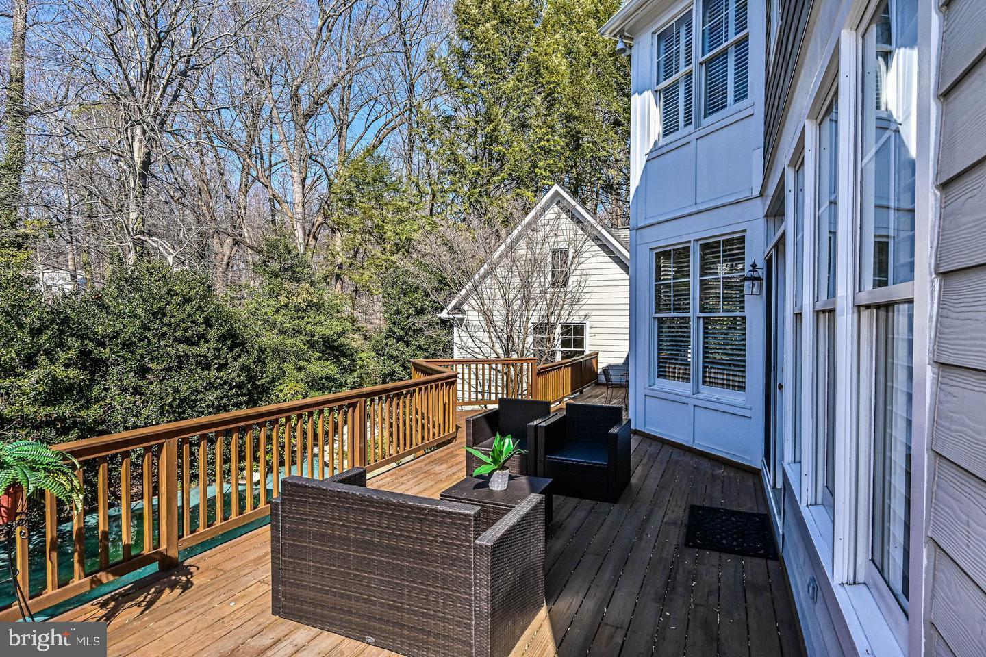 6516 76th Place Cabin John, MD 20818 - Photo 21 of 46 a view of balcony with wooden floor and seating space