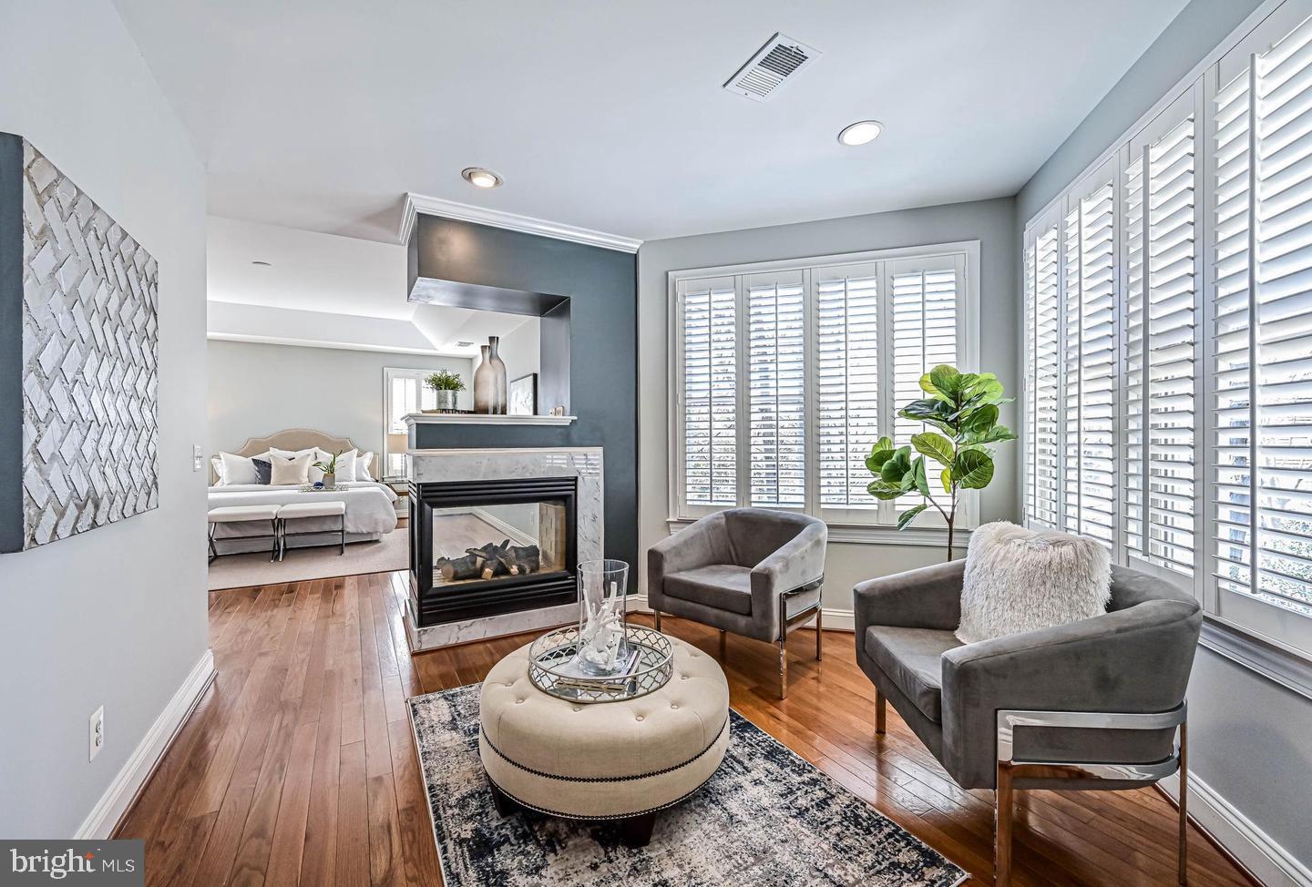 6516 76th Place Cabin John, MD 20818 - Photo 23 of 46 a living room with furniture and a fireplace