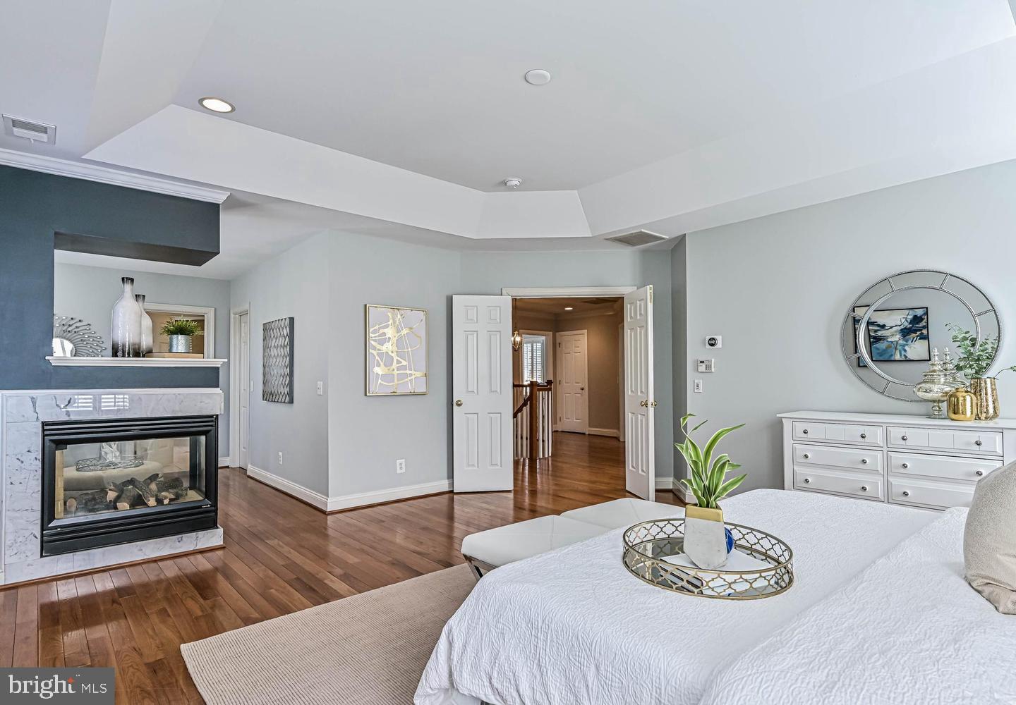 6516 76th Place Cabin John, MD 20818 - Photo 24 of 46 a living room with furniture and a fireplace