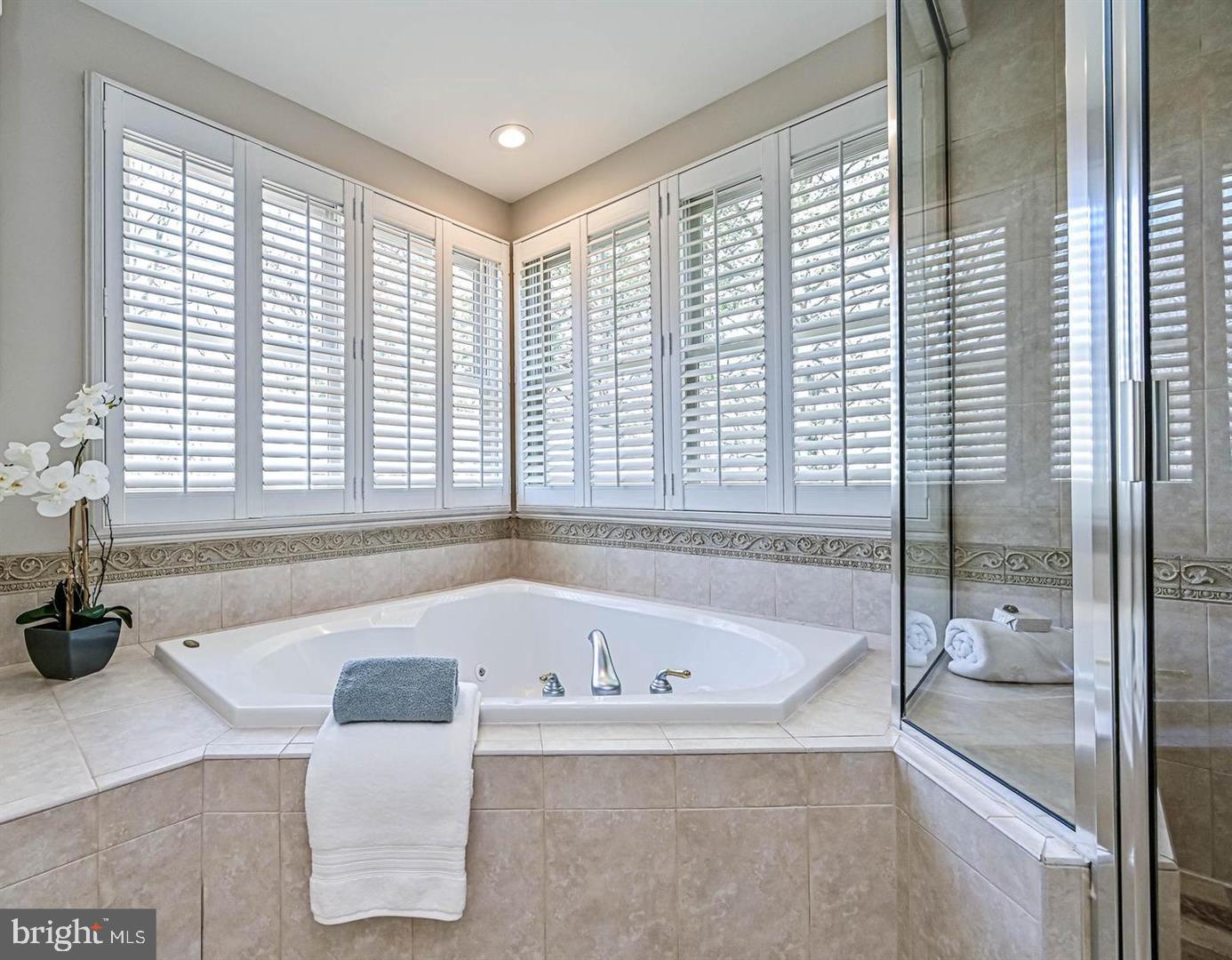 6516 76th Place Cabin John, MD 20818 - Photo 26 of 46 a bathroom with a bathtub and a window