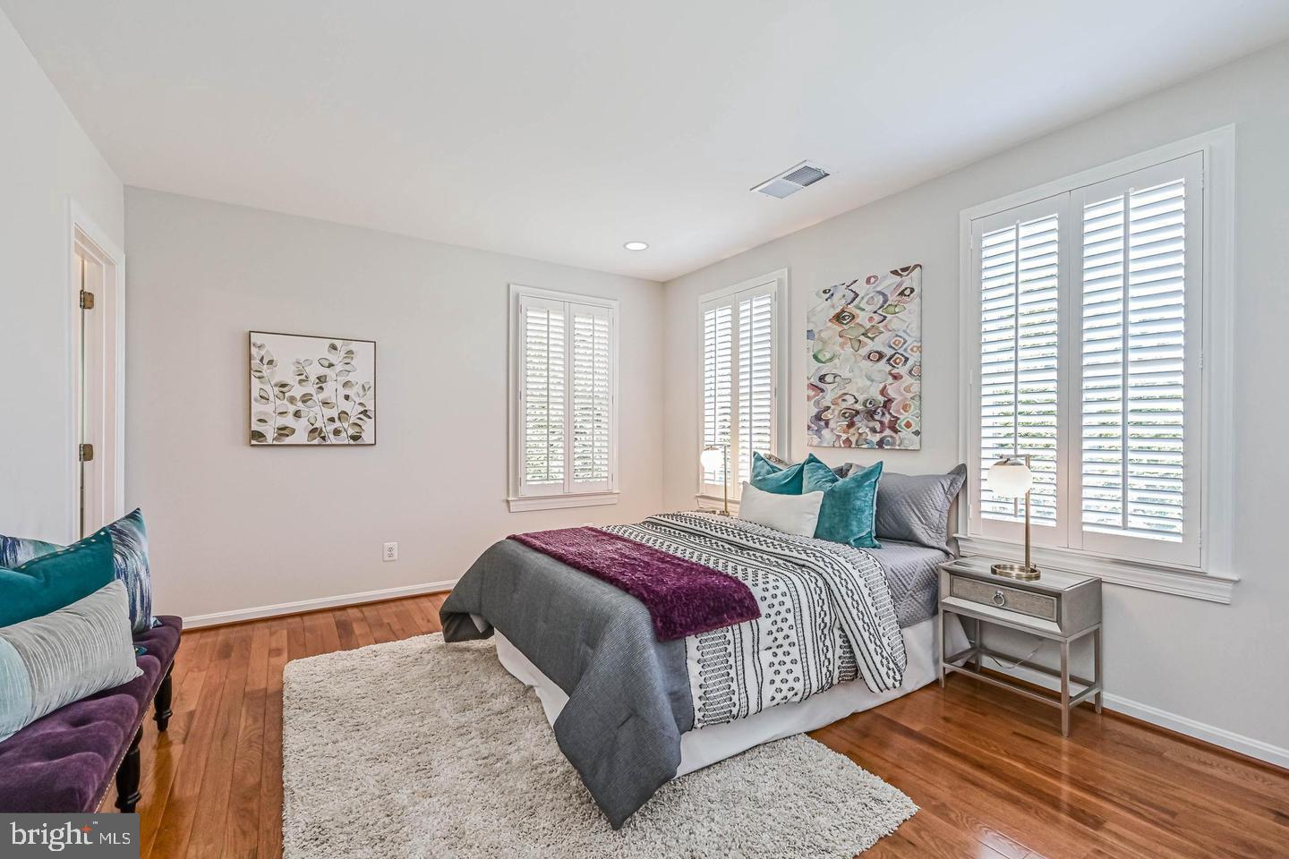 6516 76th Place Cabin John, MD 20818 - Photo 28 of 46 a bedroom with a bed lamp and a window