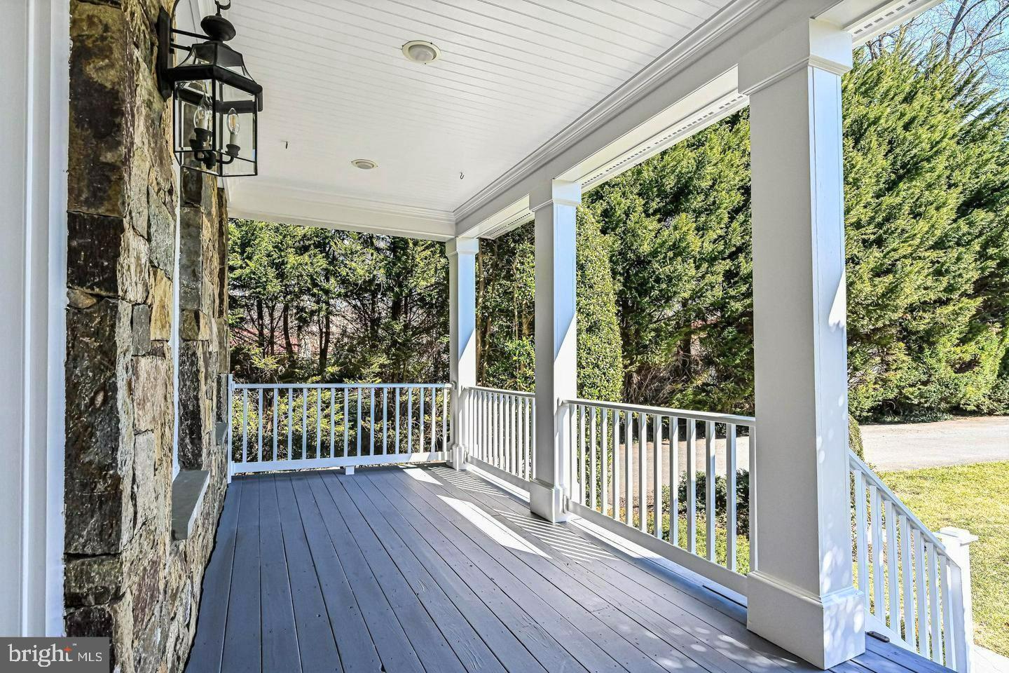 6516 76th Place Cabin John, MD 20818 - Photo 3 of 46 a view of a balcony with wooden floor