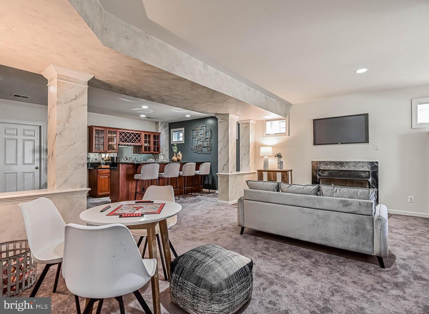 6516 76th Place Cabin John, MD 20818 - Photo 32 of 46 a living room with furniture and a flat screen tv