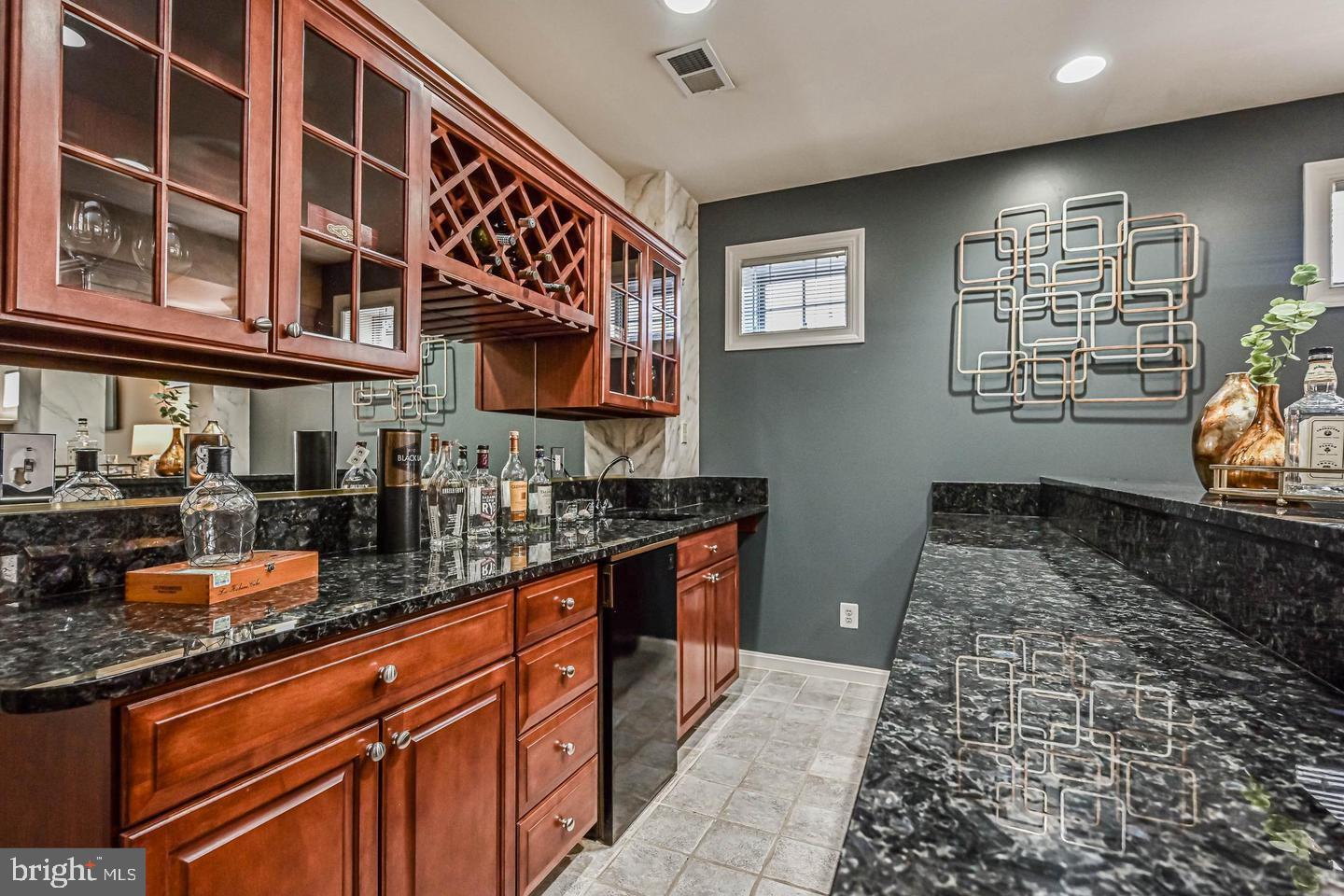 6516 76th Place Cabin John, MD 20818 - Photo 36 of 46 a kitchen with granite countertop lots of counter top space