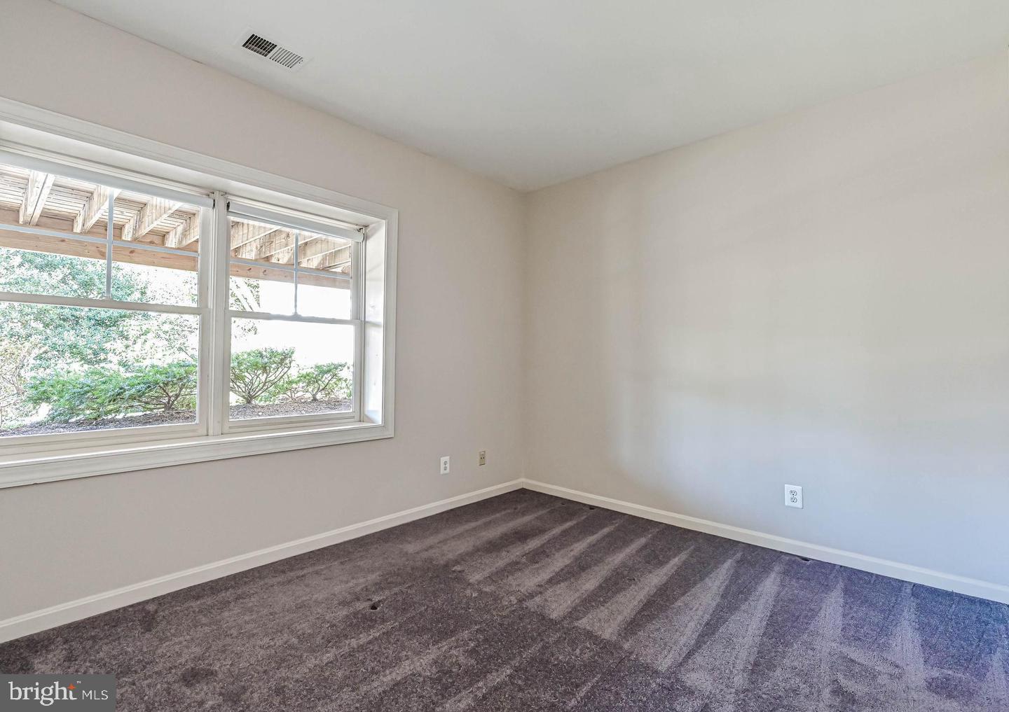 6516 76th Place Cabin John, MD 20818 - Photo 39 of 46 an empty room with a window