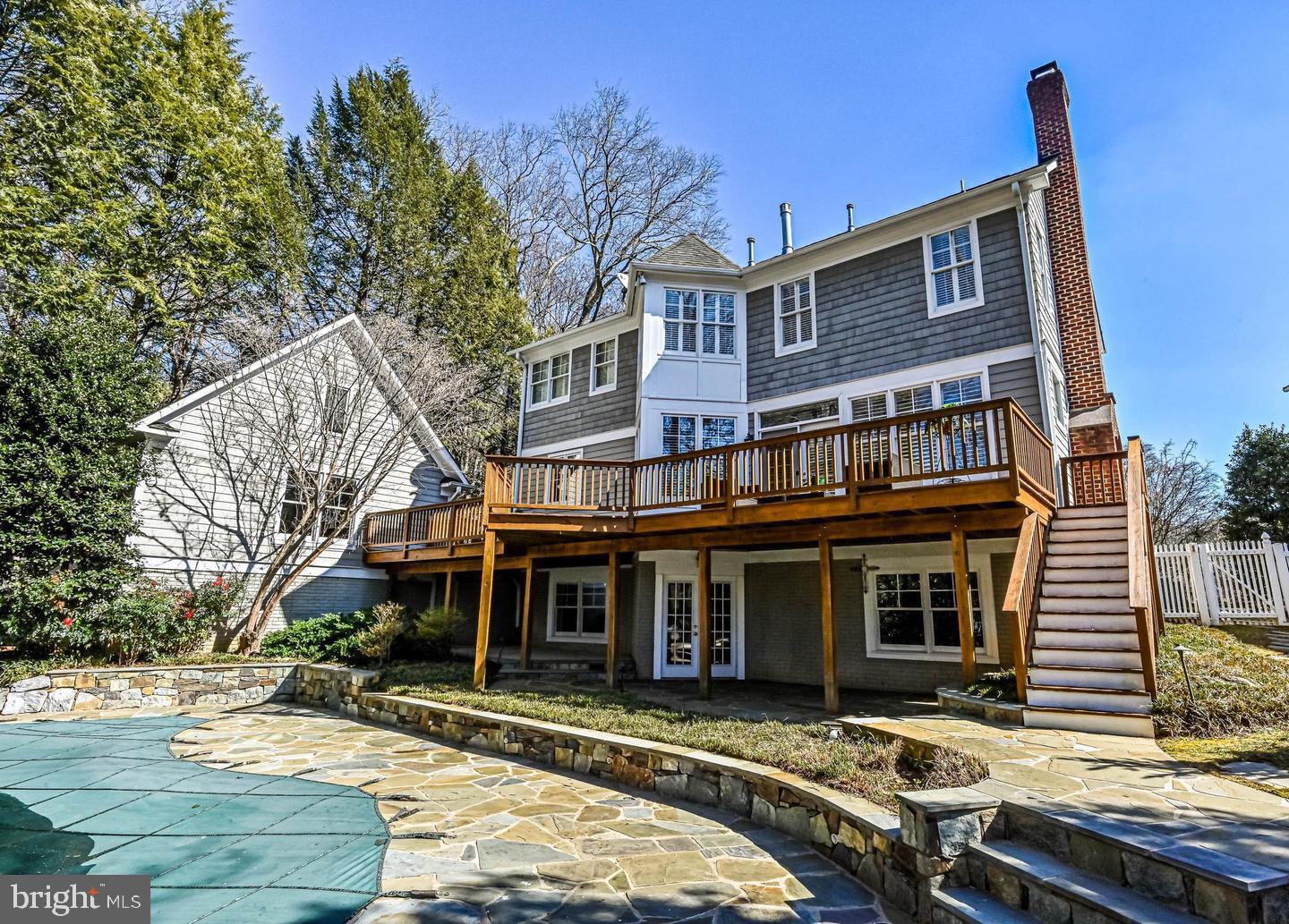 6516 76th Place Cabin John, MD 20818 - Photo 43 of 46 a front view of a house with a yard