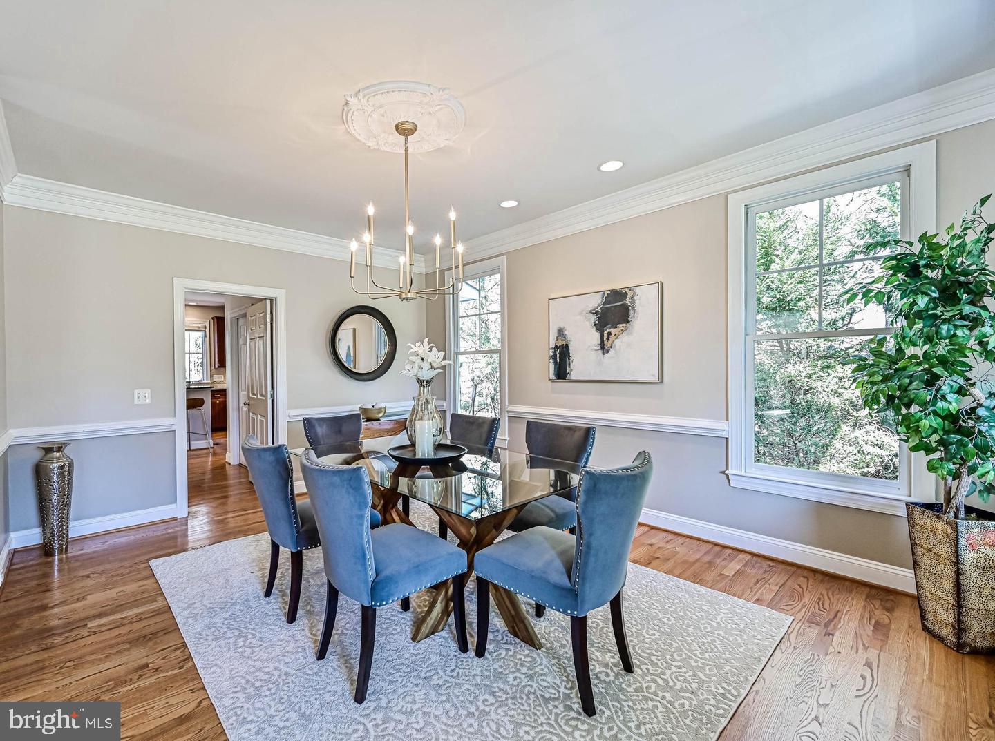 6516 76th Place Cabin John, MD 20818 - Photo 8 of 46 a view of a dining room with furniture window and wooden floor