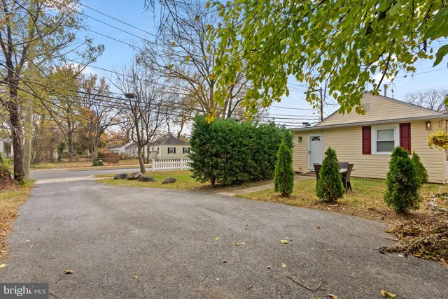 a front view of house with a garden