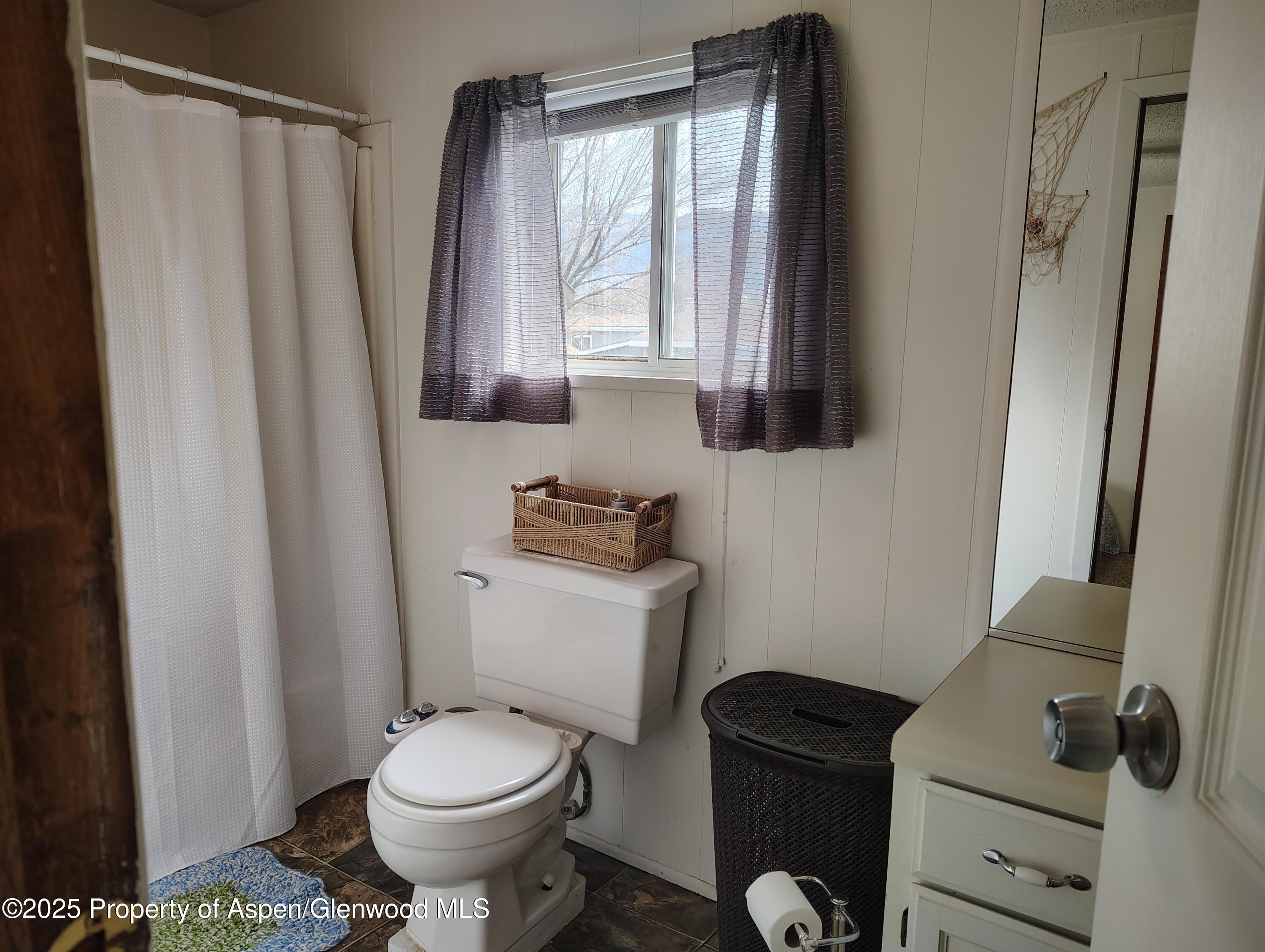8 St John Circle Parachute, CO 81635 - Photo 19 of 32 a bathroom with a toilet and a sink