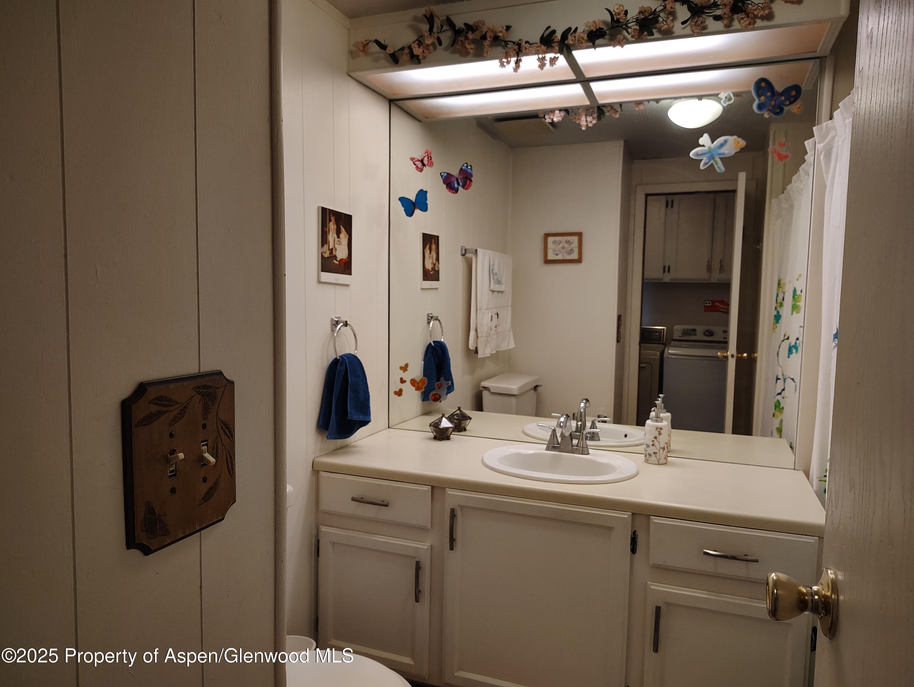 8 St John Circle Parachute, CO 81635 - Photo 25 of 32 a bathroom with a sink and a mirror