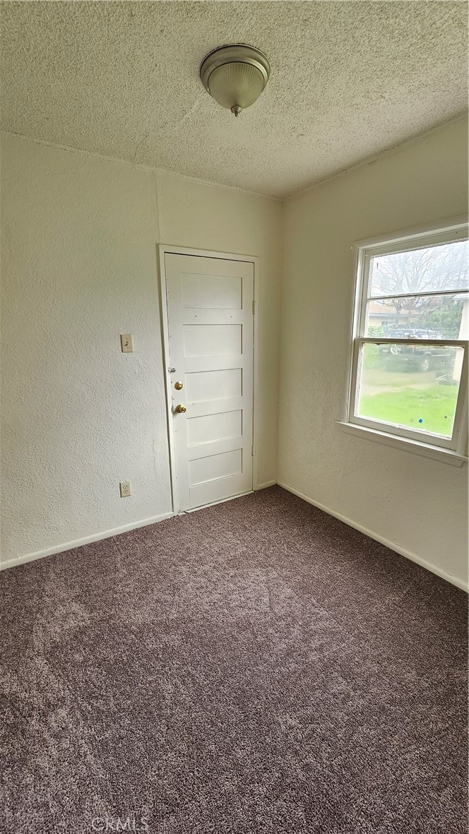 1410 Canyon Road San Bernardino, CA 92404 - Photo 3 of 6 an empty room with windows