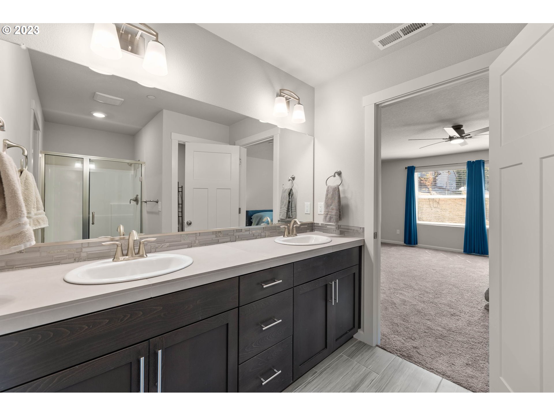 2339 South Brookside Place Ridgefield, WA 98642 - Photo 34 of 38 a bathroom with a sink double vanity granite and a mirror