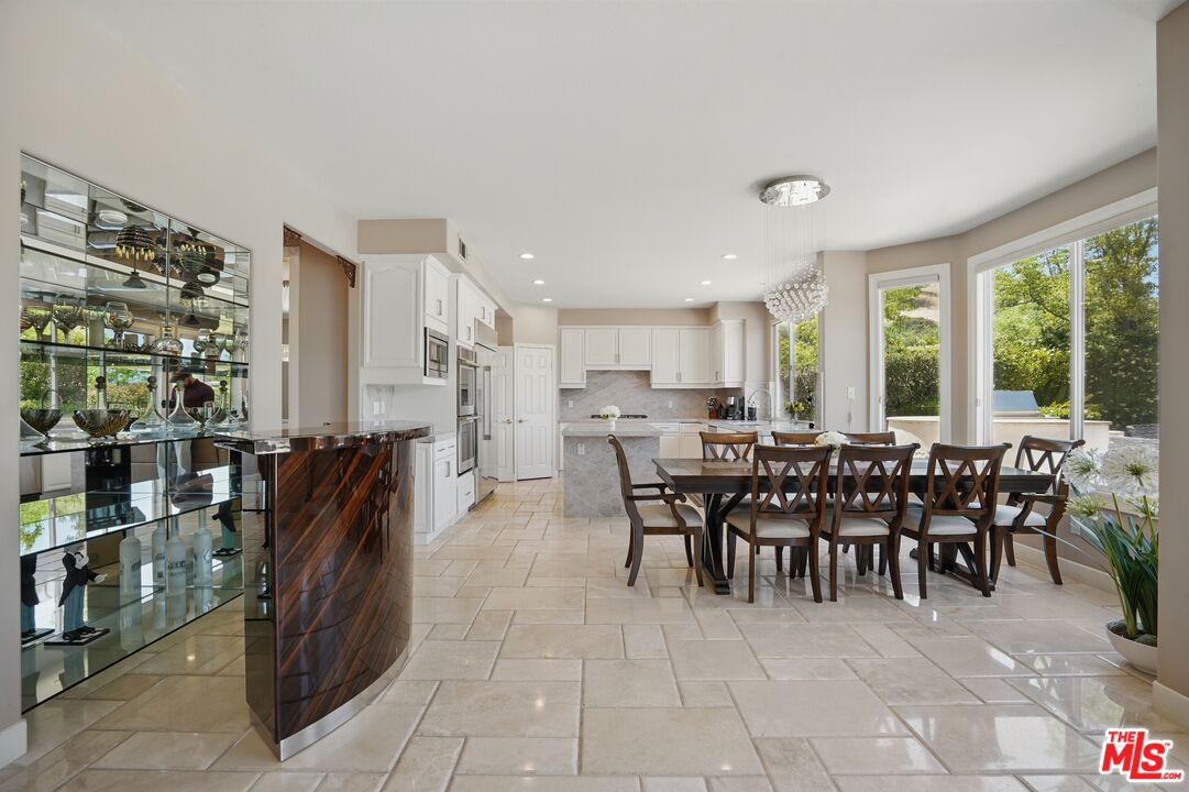 4040 Leighton Point Road Calabasas, CA 91301 - Photo 16 of 47 a view of a dining room with furniture