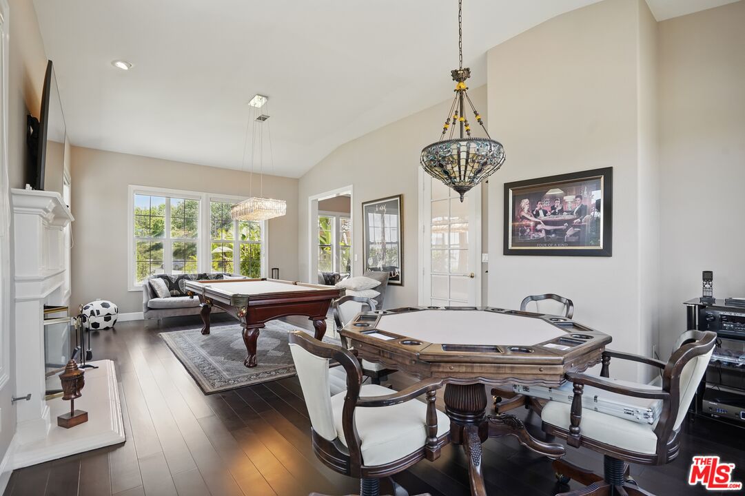 4040 Leighton Point Road Calabasas, CA 91301 - Photo 23 of 47 a view of a dining room with furniture window and wooden floor