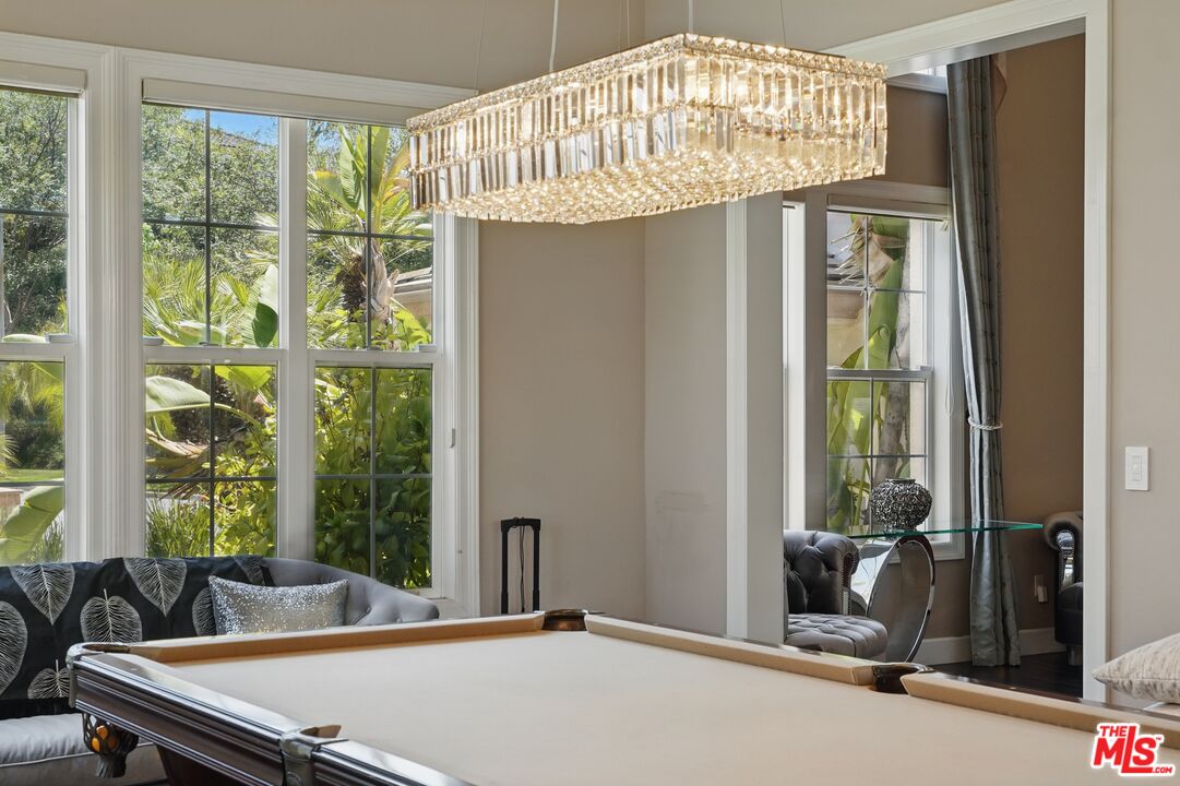 4040 Leighton Point Road Calabasas, CA 91301 - Photo 24 of 47 a room with pool table and windows