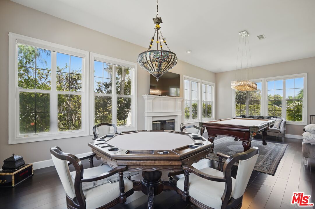 4040 Leighton Point Road Calabasas, CA 91301 - Photo 25 of 47 a view of a dining room with furniture window and outside view