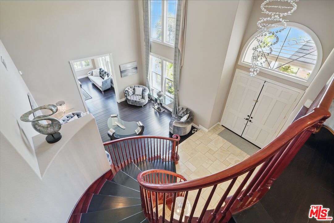 4040 Leighton Point Road Calabasas, CA 91301 - Photo 28 of 47 a dining room with furniture a rug and wooden floor