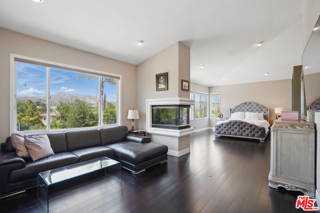 4040 Leighton Point Road Calabasas, CA 91301 - Photo 29 of 47 a living room with furniture and a fireplace
