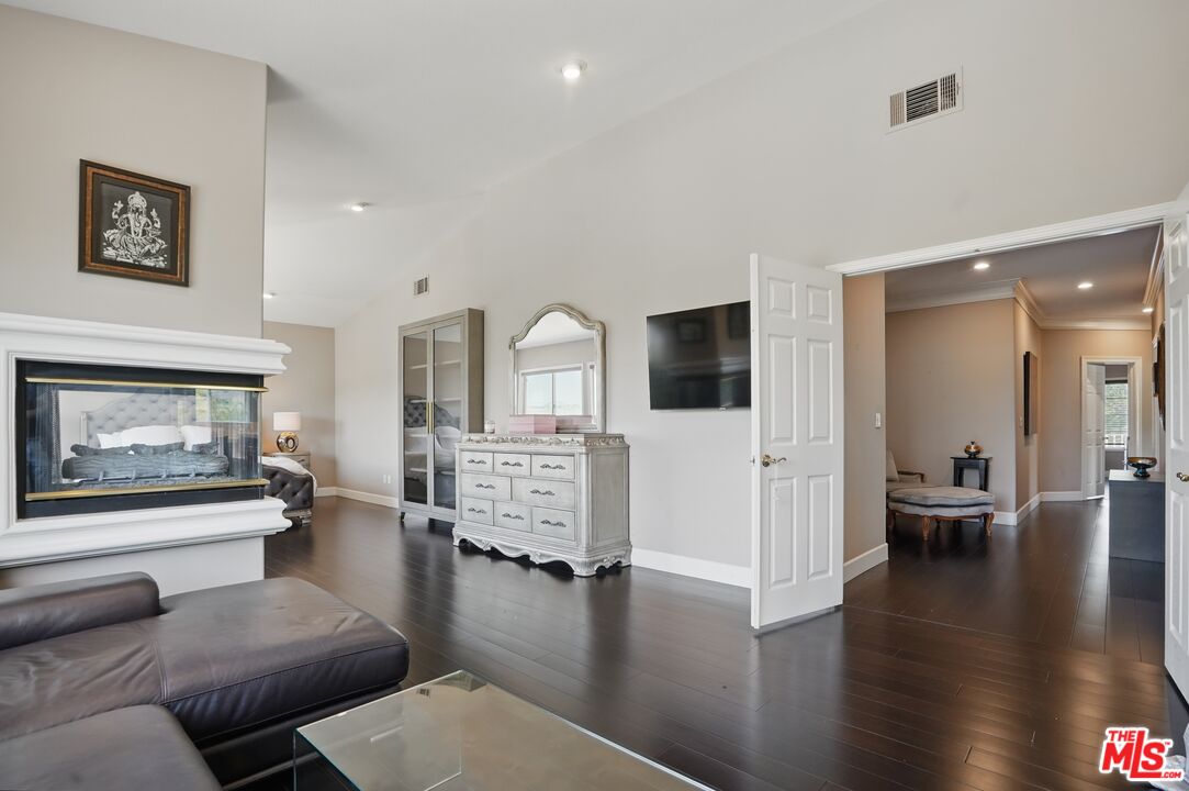 4040 Leighton Point Road Calabasas, CA 91301 - Photo 31 of 47 a living room with furniture and wooden floor