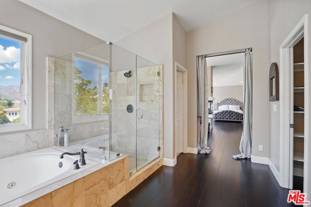 4040 Leighton Point Road Calabasas, CA 91301 - Photo 35 of 47 a en suite bathroom with a tub shower and a sink