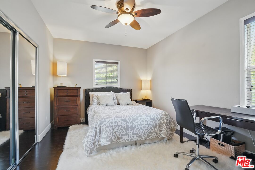 4040 Leighton Point Road Calabasas, CA 91301 - Photo 41 of 47 a bedroom with a bed and a chandelier