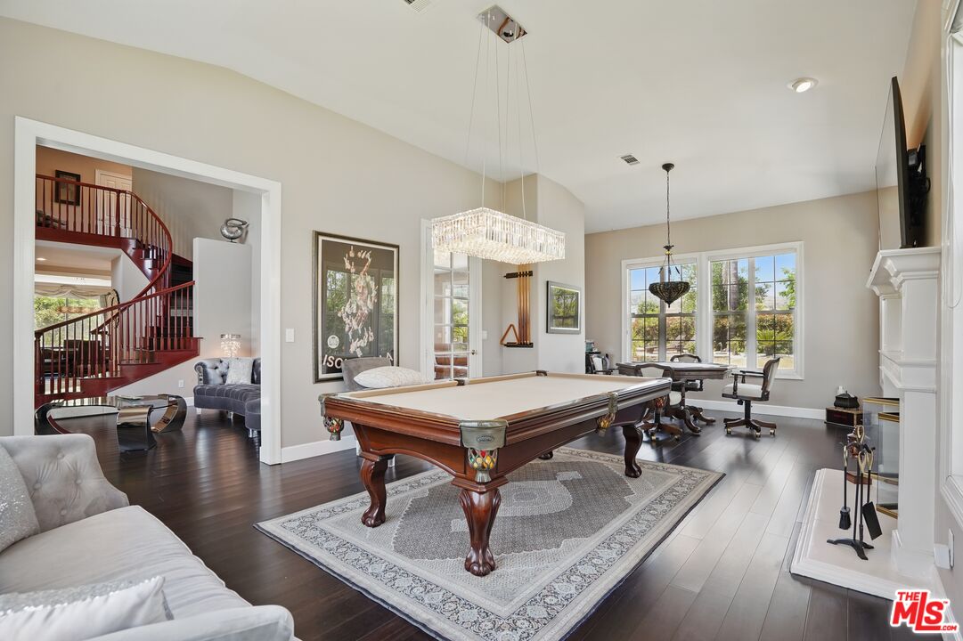 4040 Leighton Point Road Calabasas, CA 91301 - Photo 5 of 47 a living room with furniture a table and a large window
