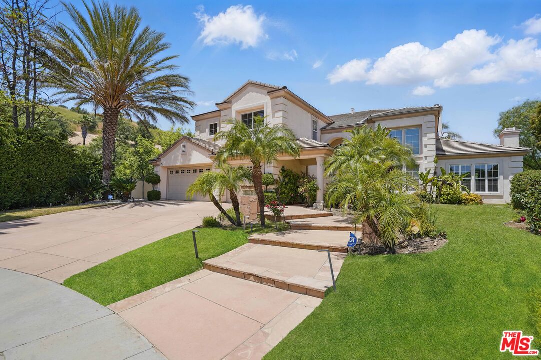 4040 Leighton Point Road Calabasas, CA 91301 - Photo 9 of 47 a view of a house with a yard and potted plants
