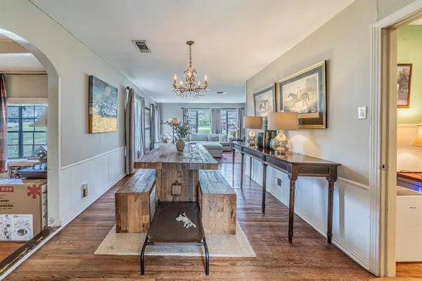 a kitchen with stainless steel appliances a stove a sink and a refrigerator