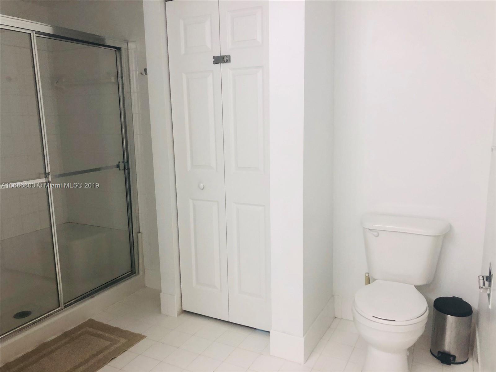 17100 North Bay Road, Unit 1212 Sunny Isles Beach, FL 33160 - Photo 20 of 24 a bathroom with a toilet