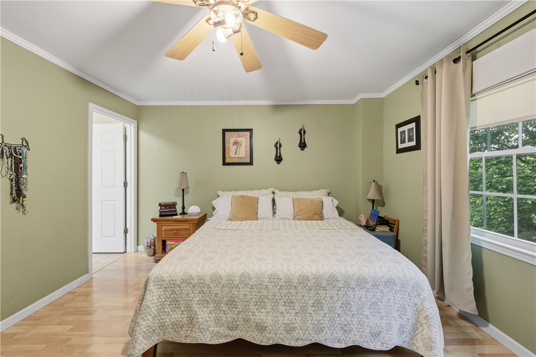 2001 Ridgeview Lane Seneca, SC 29678 - Photo 22 of 27 A comforting bedroom space features warm wood flooring and a modern ceiling fan for ultimate relaxation.