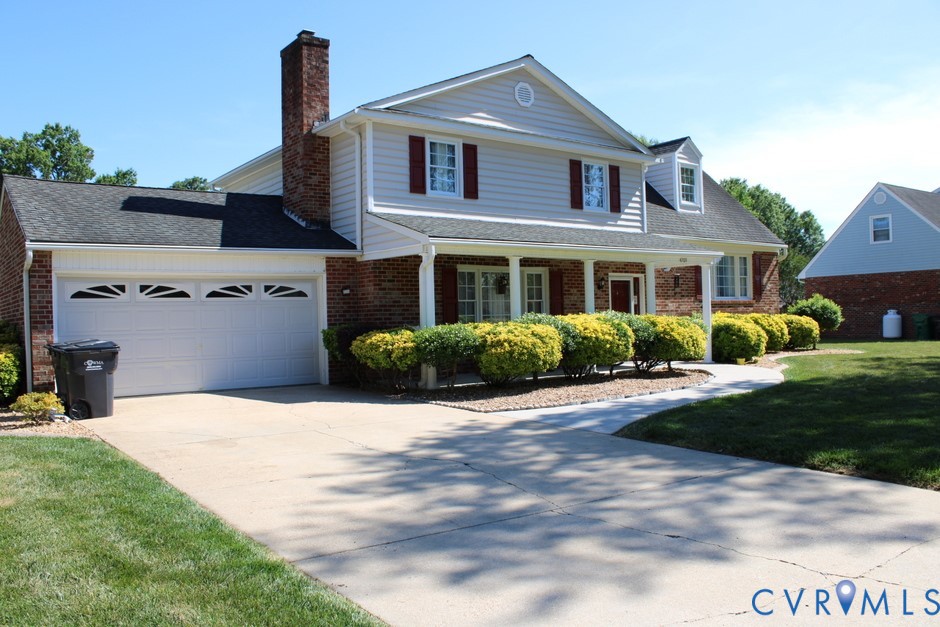 4709 Ridgecrest Lane Colonial Heights, VA 23834 - Photo 2 of 3 a front view of a house with a yard