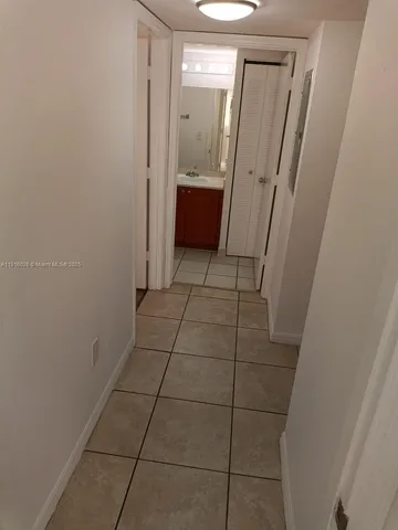 a bathroom with a sink a toilet and a shower