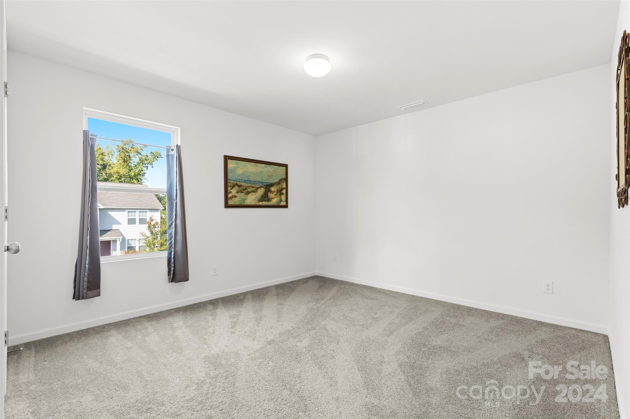 1015 Cherry Bark Place Landis, NC 28088 - Photo 19 of 24 an empty room with windows