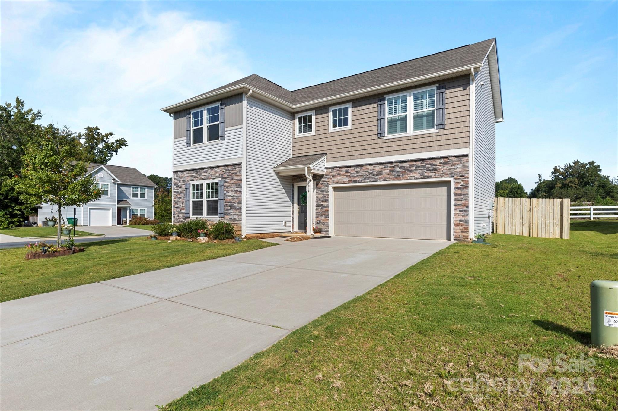 1015 Cherry Bark Place Landis, NC 28088 - Photo 2 of 24 a front view of a house with a yard and garage