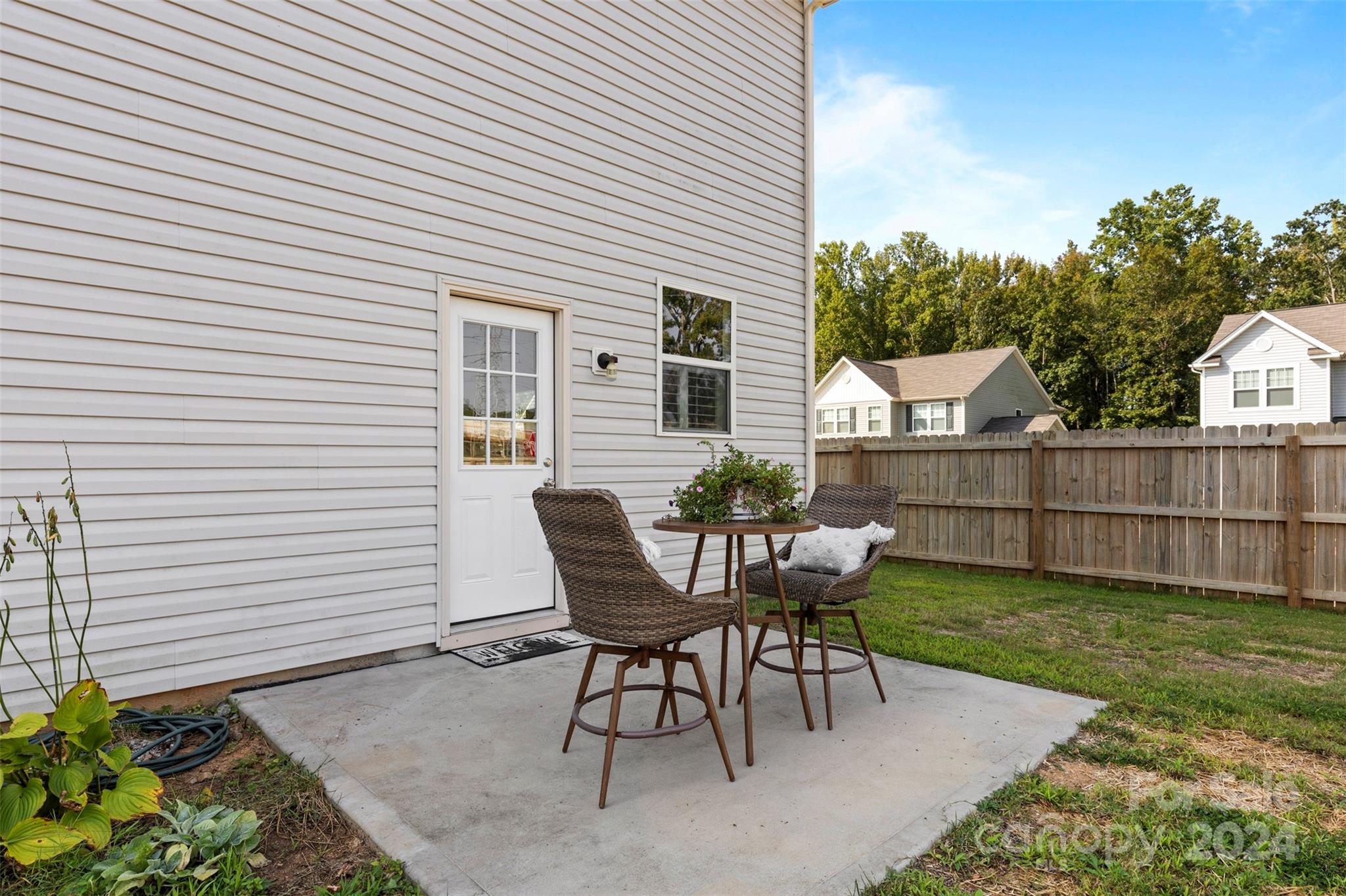 1015 Cherry Bark Place Landis, NC 28088 - Photo 22 of 24 a view of a chair and table in backyard